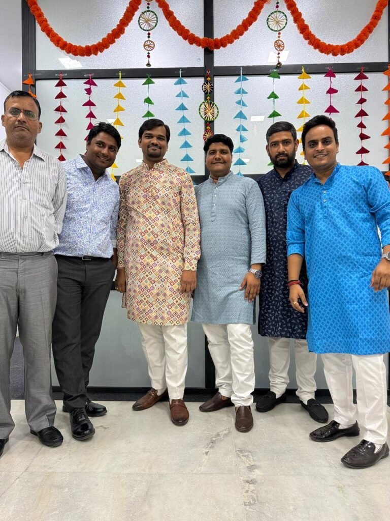 EXP team members in festive clothing at an office celebration